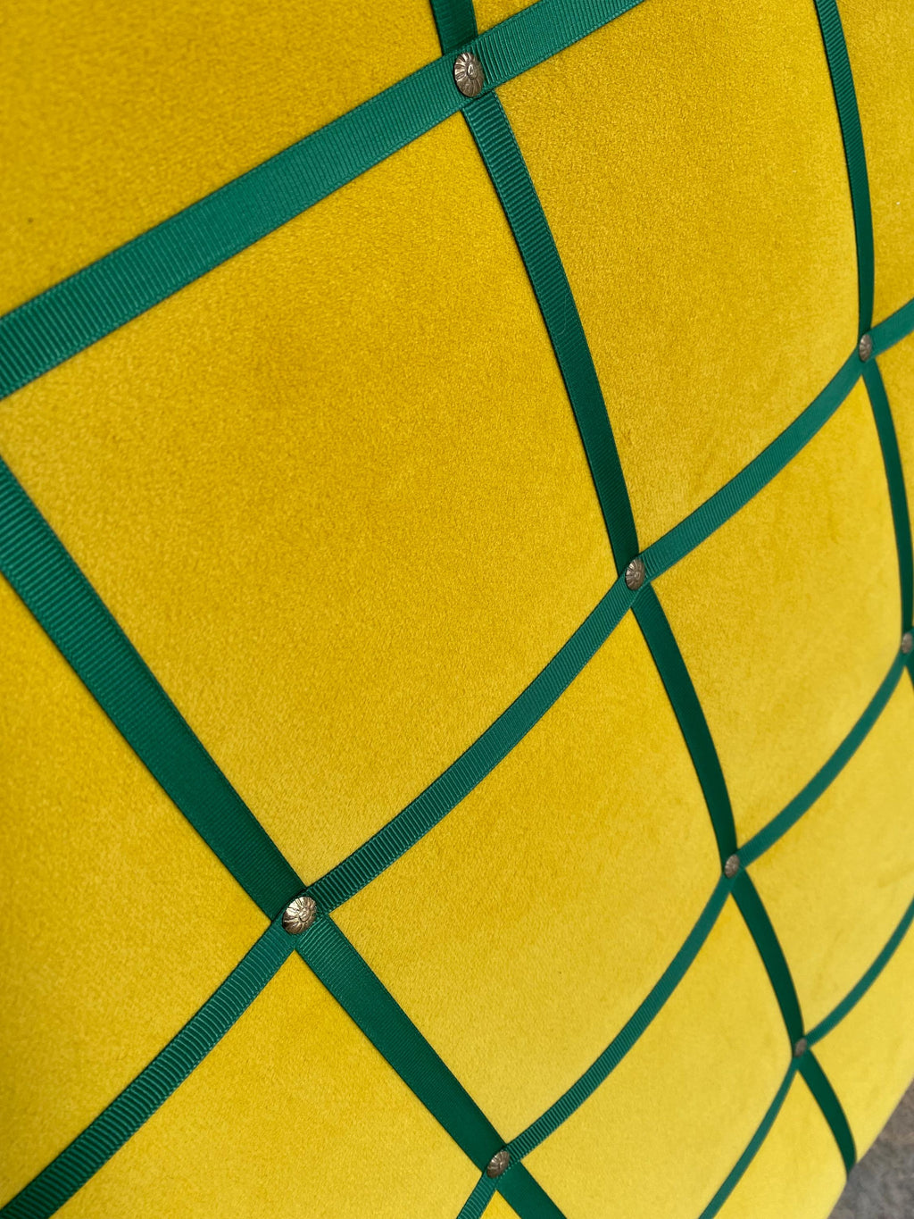 Yellow velvet fabric noticeboard for memos, photos, business cards. Green ribbon in square grid pattern. Great display board.