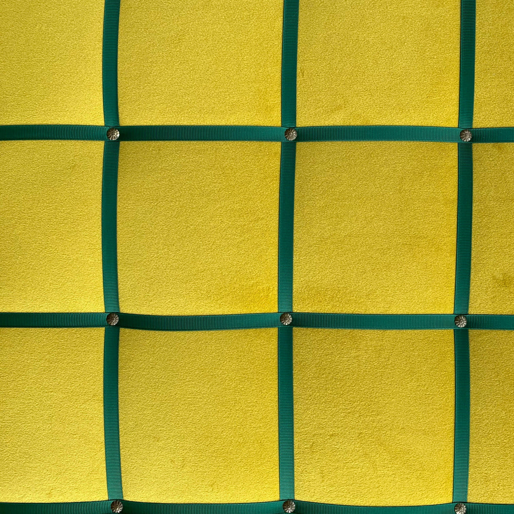 Yellow velvet fabric noticeboard for memos, photos, business cards. Green ribbon in square grid pattern. Great display board.