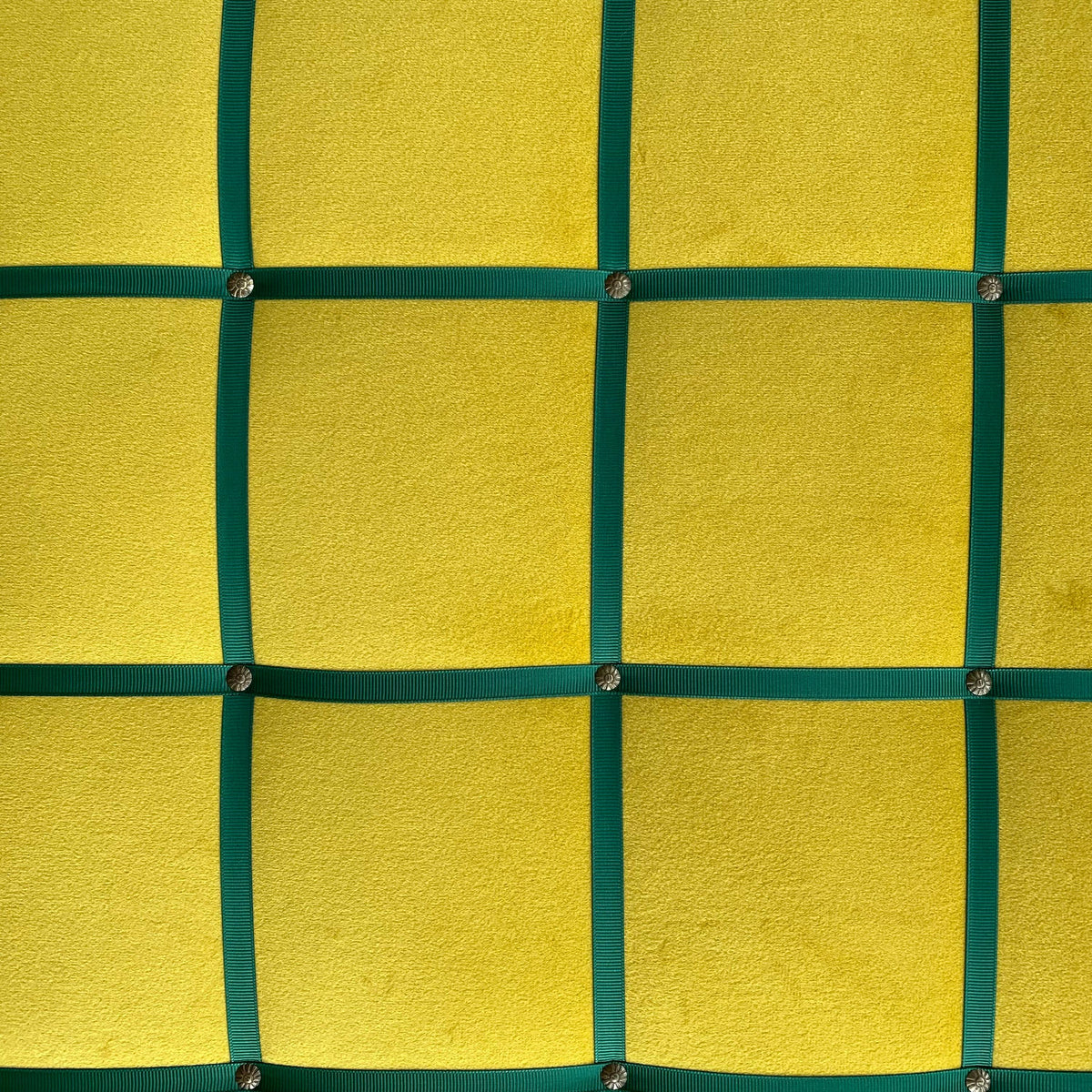 Yellow velvet fabric noticeboard for memos, photos, business cards. Green ribbon in square grid pattern. Great display board.