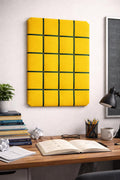 Yellow velvet fabric noticeboard for memos, photos, business cards. Green ribbon in square grid pattern. Great display board.