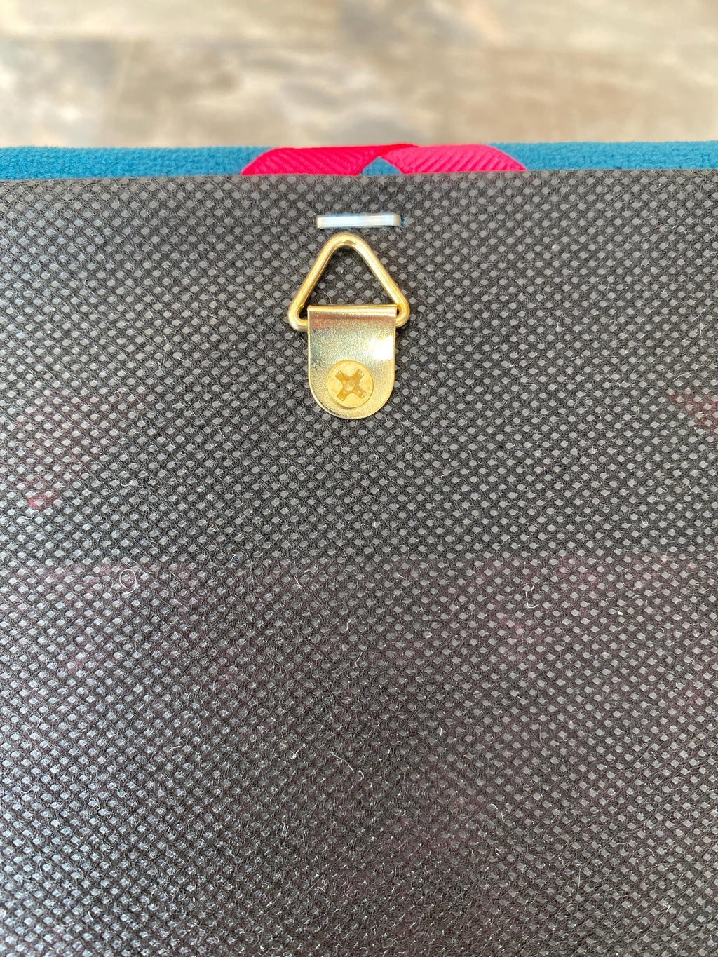 Navy cord fabric noticeboard with pale blue zig-zag ribbon. Holds memos, photos, notes and more. Handmade at home by me!