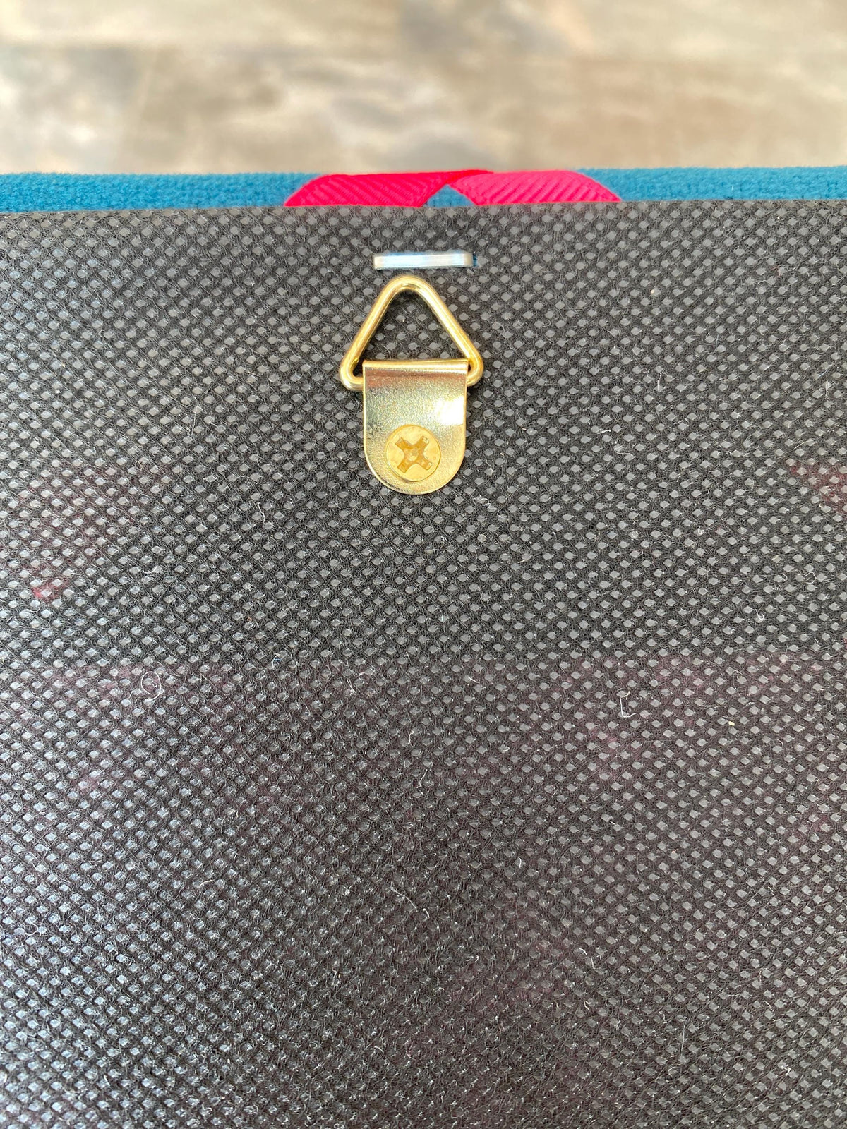 Navy cord fabric noticeboard with pale blue zig-zag ribbon. Holds memos, photos, notes and more. Handmade at home by me!