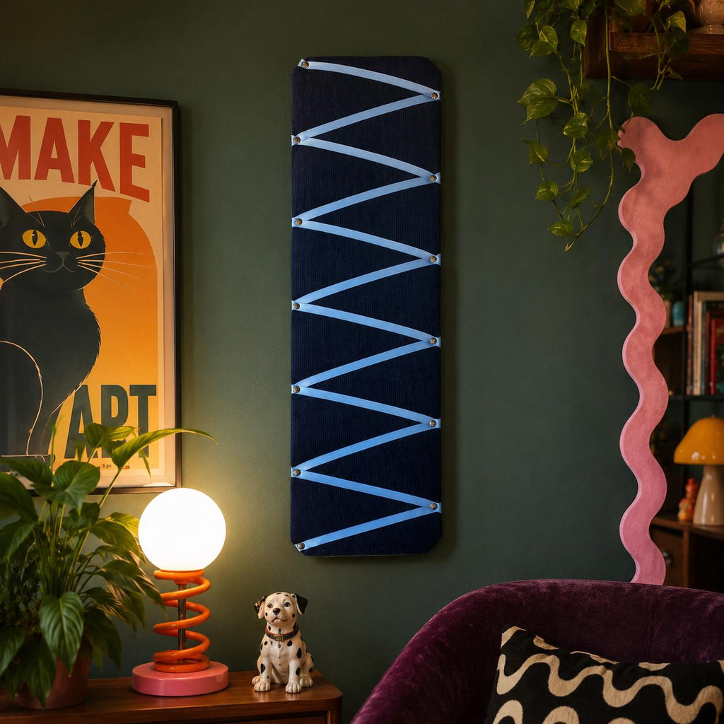 Navy cord fabric noticeboard with pale blue zig-zag ribbon. Holds memos, photos, notes and more. Handmade at home by me!