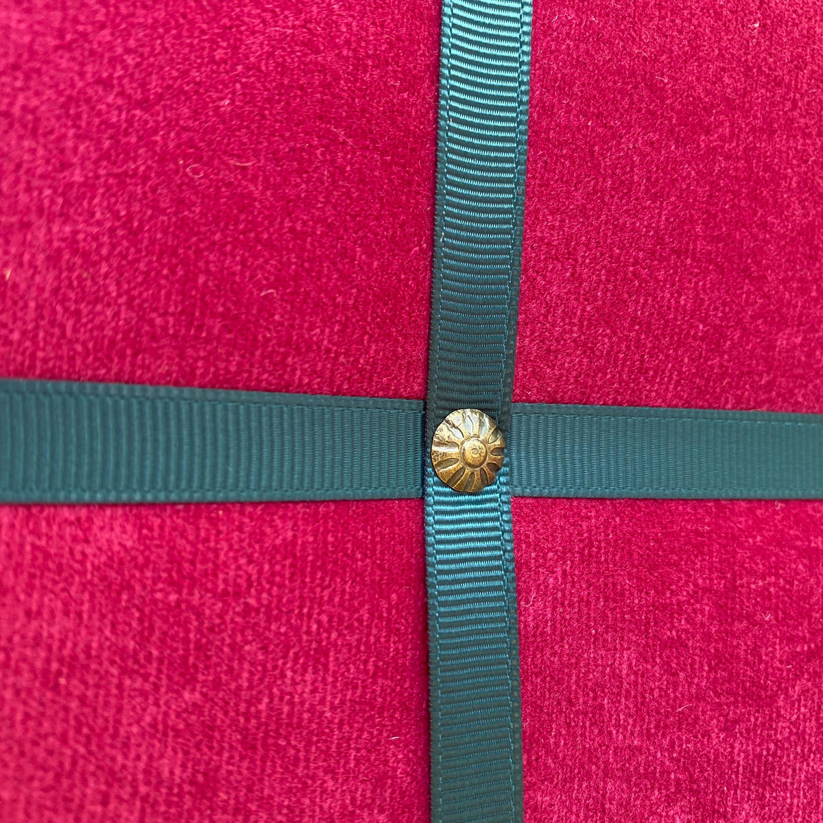 Magenta fabric noticeboard with teal ribbon in a modern square design. Holds memos, photos, notes and more. Handmade with local fabric.